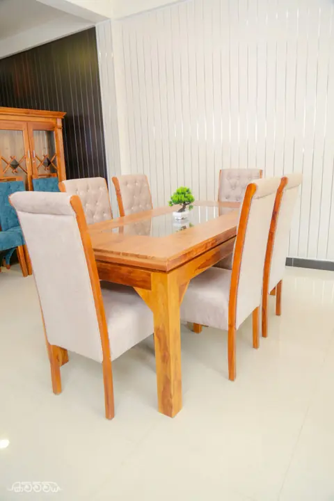Teak dining table with upholstered chairs by Kavichchiya Furniture