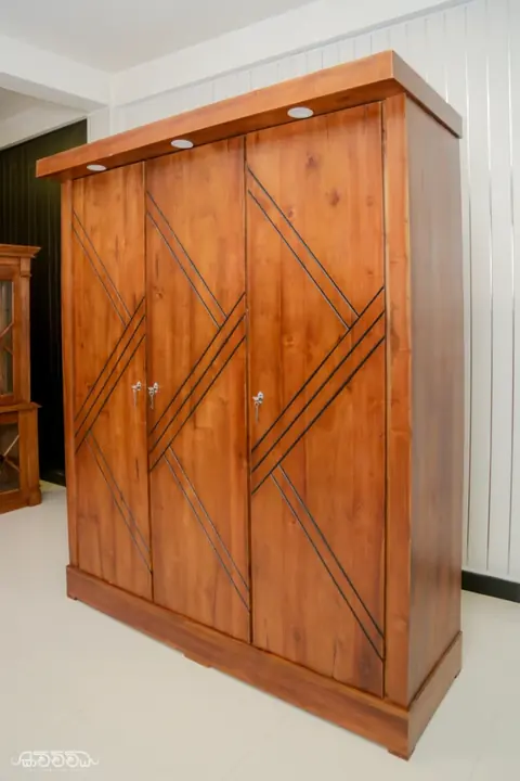 Teak wardrobe with inlaid door pattern by Kavichchiya Furniture
